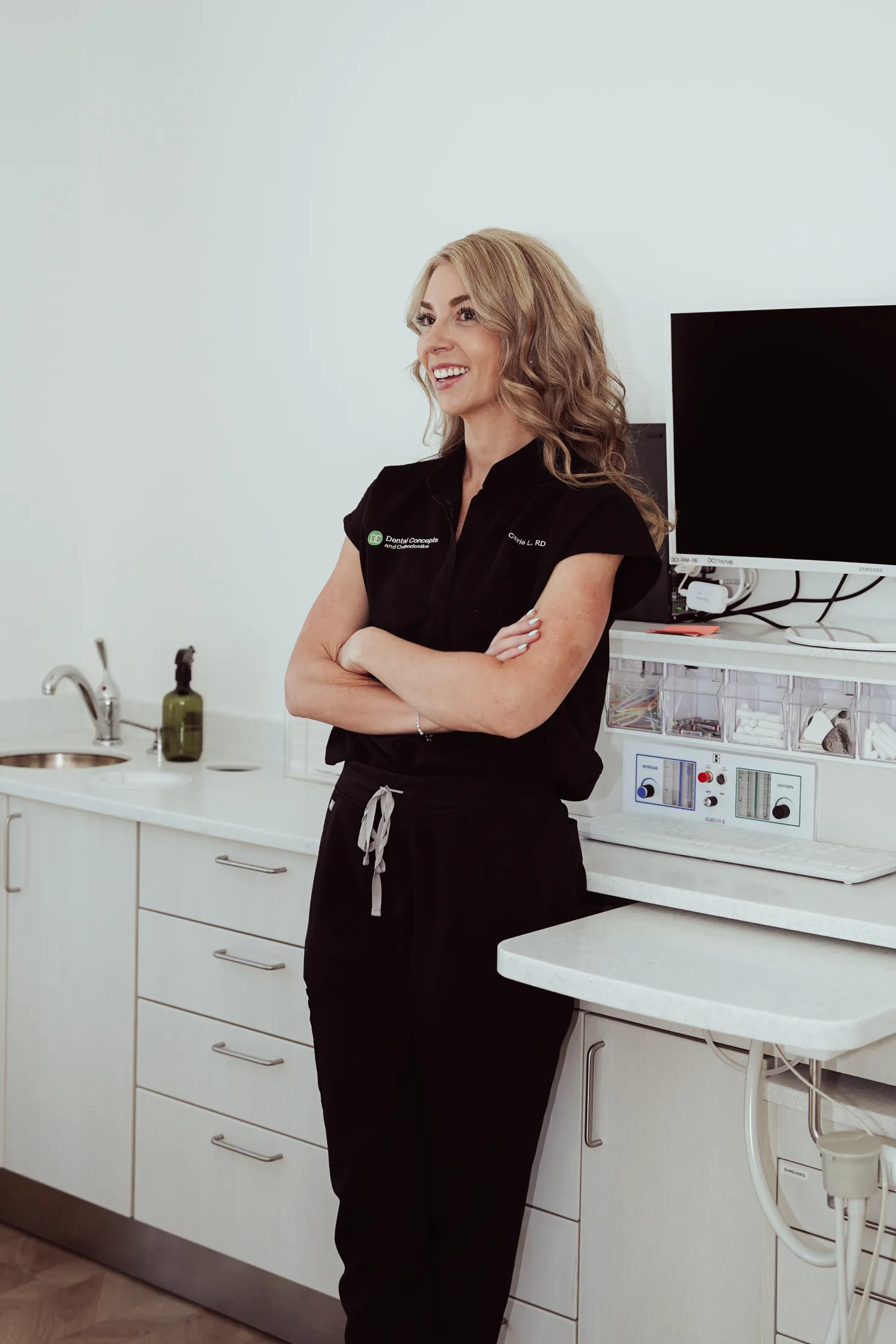 A Dental Concepts team member standing in a treatment room