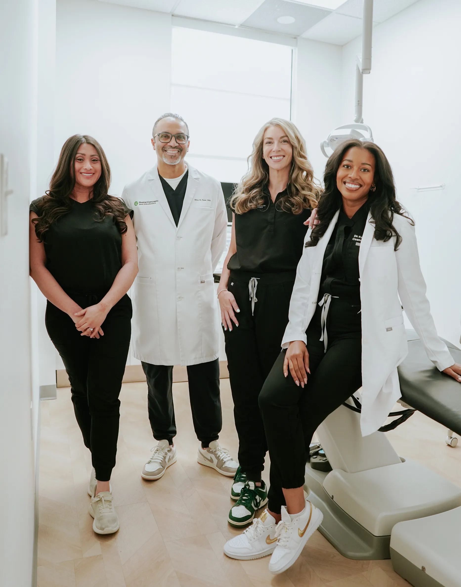 Both Dental Concepts dentists with members of the clinical team in a treatment room