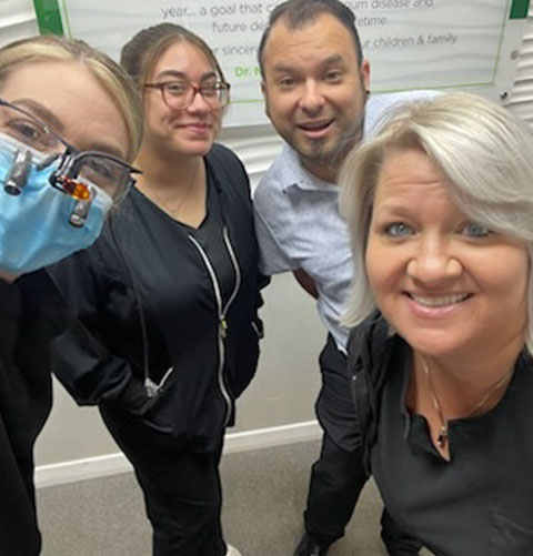 Members of the Dental Concepts team taking a selfie in the office